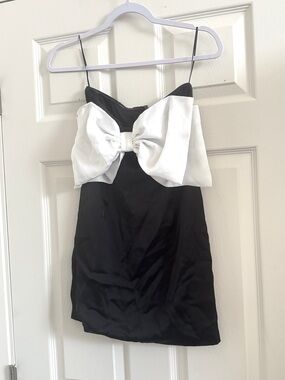 Brand new never worn: White Bow Accent Mini Dress with black satin